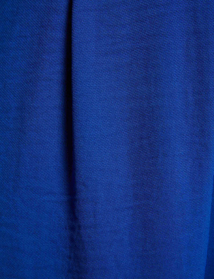 Combinaison jambe large détail boucle