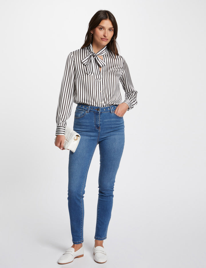 Jeans slim détails oeillets