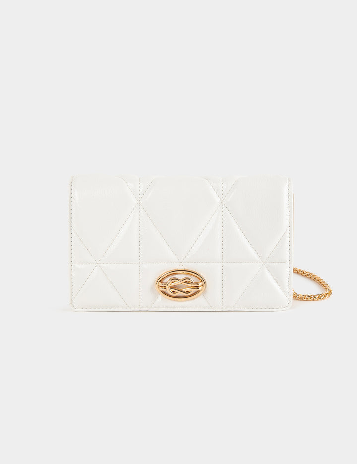 Sac pochette matelassé en bandoulière