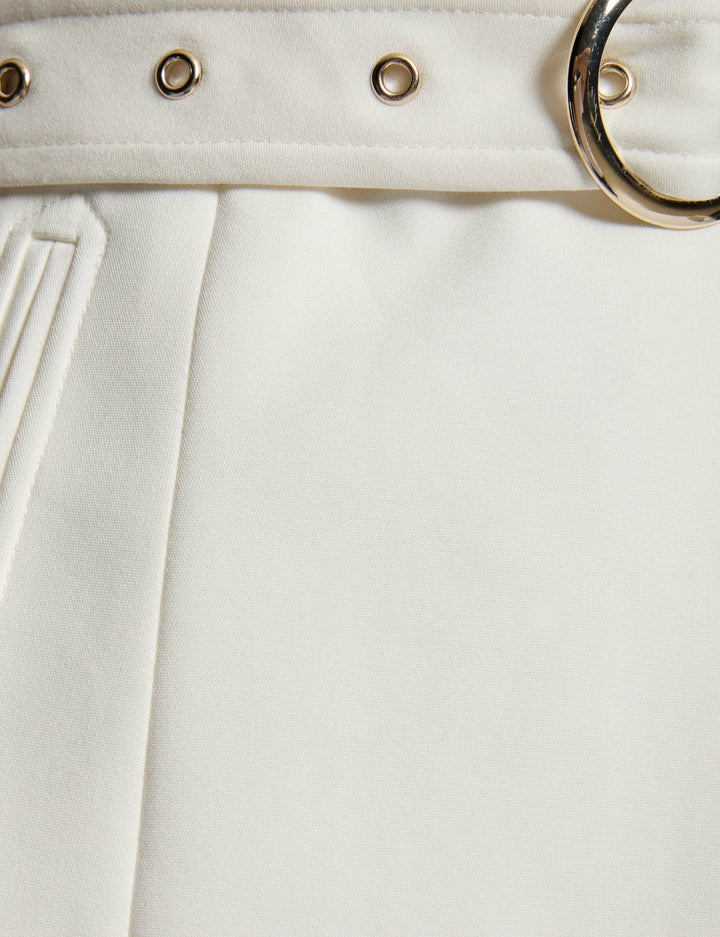 Veste droite sans manches ceinturée
