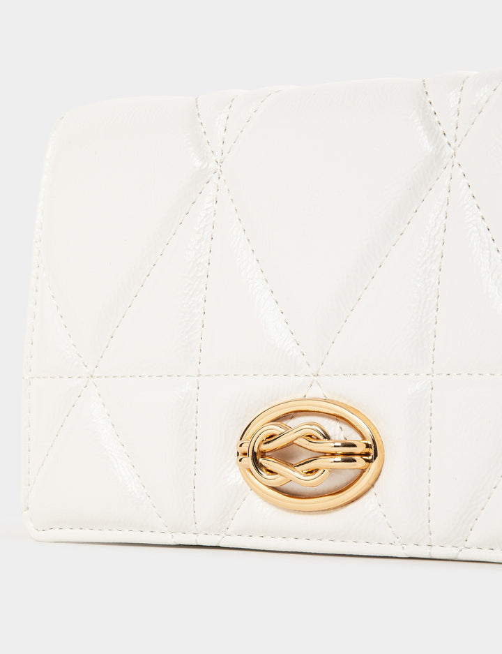 Sac pochette matelassé en bandoulière